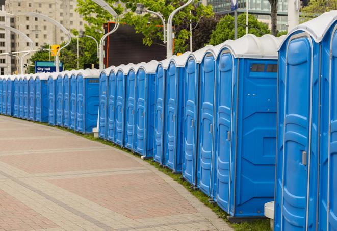 portable restrooms with sink and hand sanitizer stations, available at a festival in Bennet, NE